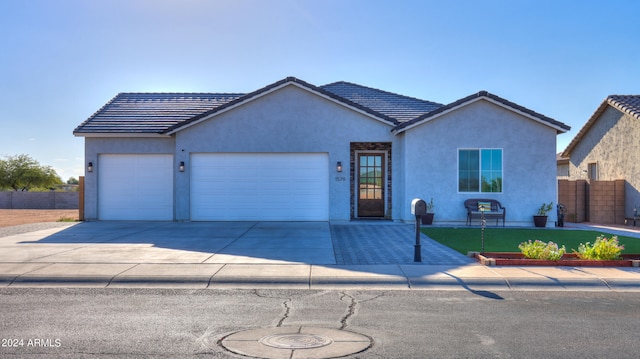 single story home featuring a garage