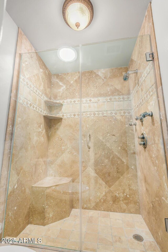 bathroom with a shower stall