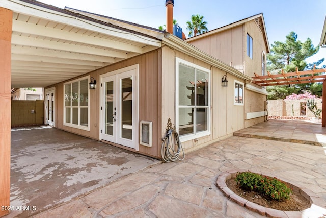 rear view of property featuring a patio, fence, and a pergola