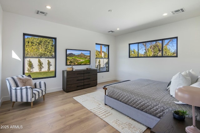 bedroom with light hardwood / wood-style floors