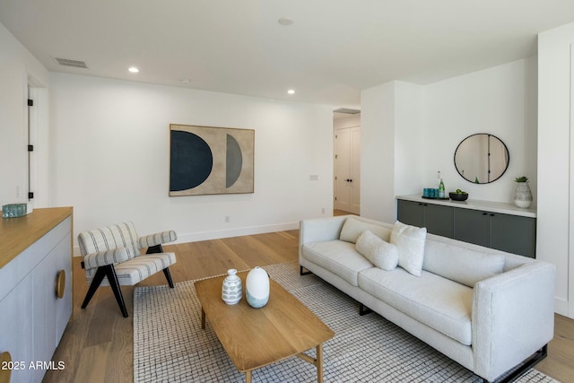 living room with light hardwood / wood-style flooring