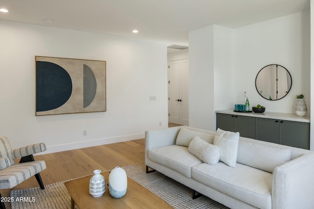 living room with light hardwood / wood-style floors