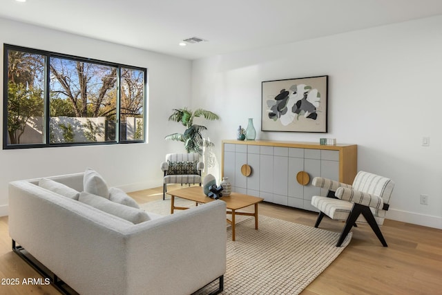 living room with light hardwood / wood-style floors