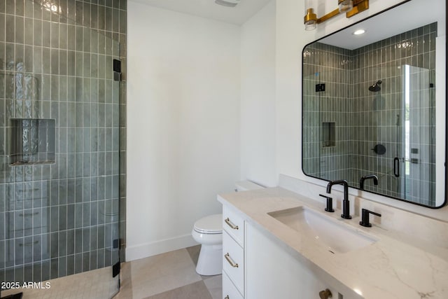 bathroom with a shower with door, tile patterned floors, toilet, and vanity