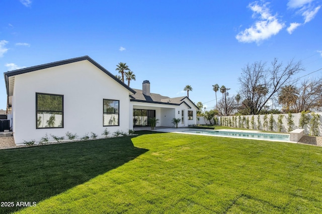 rear view of house featuring central AC unit, a fenced in pool, a patio area, and a yard