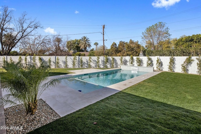 view of swimming pool featuring a lawn