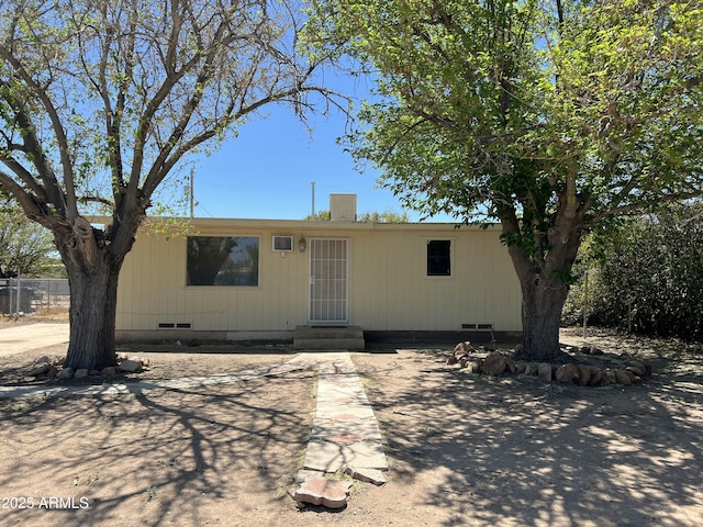 manufactured / mobile home with fence, entry steps, and crawl space