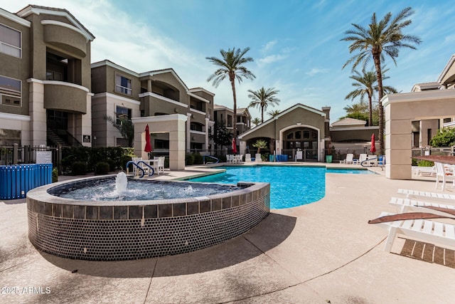 pool featuring a patio area and fence