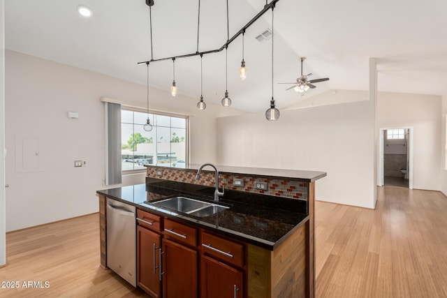 kitchen featuring light wood-style floors, visible vents, dishwasher, and a sink