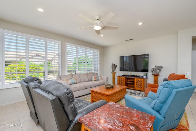 tiled living room featuring plenty of natural light and ceiling fan