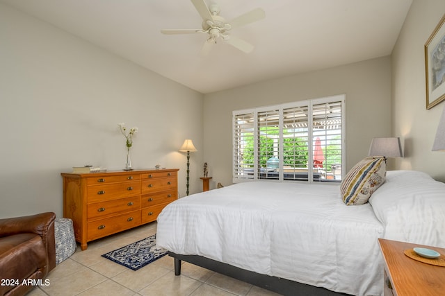 bedroom featuring light tile patterned floors and ceiling fan