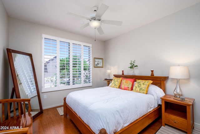 bedroom featuring hardwood / wood-style floors and ceiling fan