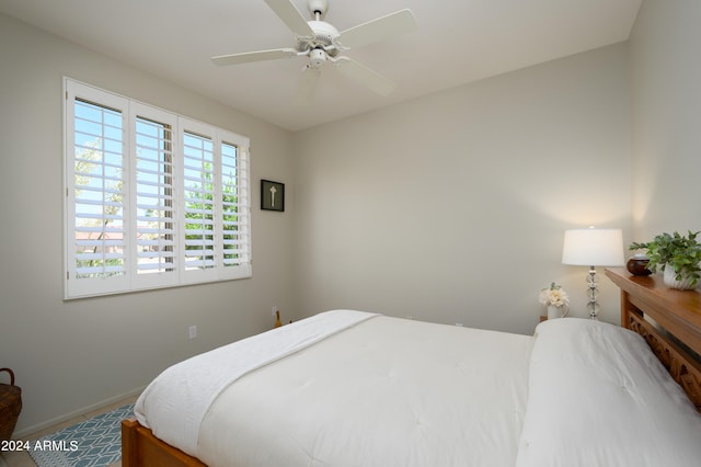 bedroom featuring ceiling fan and carpet floors