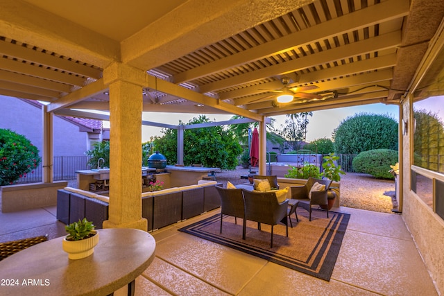 view of patio with ceiling fan and grilling area