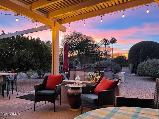 patio terrace at dusk with an outdoor fire pit