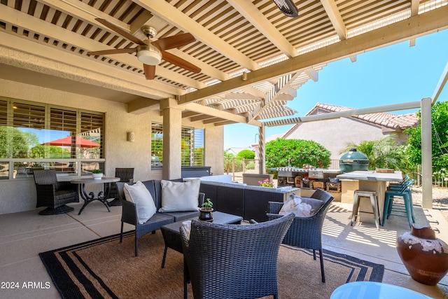 view of patio with ceiling fan, outdoor lounge area, an outdoor kitchen, and a pergola