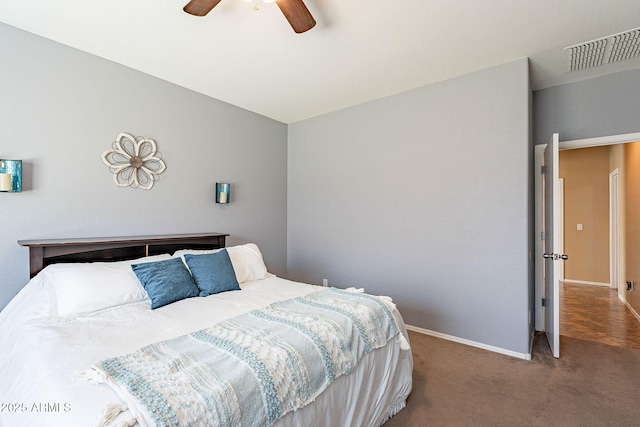 bedroom with carpet floors, baseboards, visible vents, and a ceiling fan