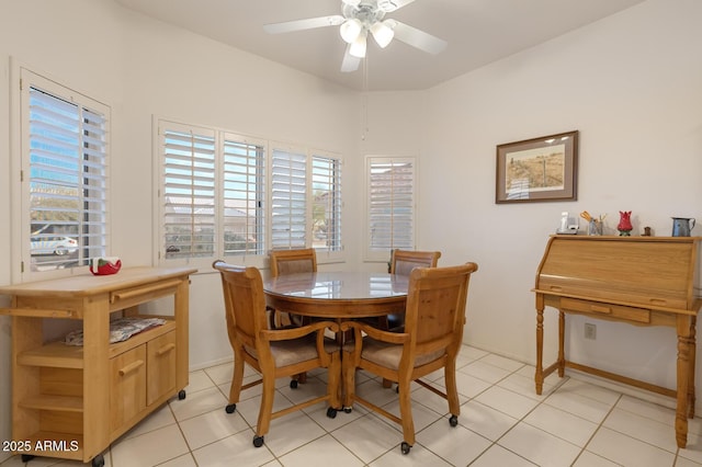 dining room with ceiling fan and light tile patterned flooring