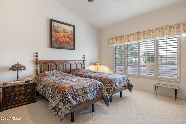 carpeted bedroom with lofted ceiling and ceiling fan