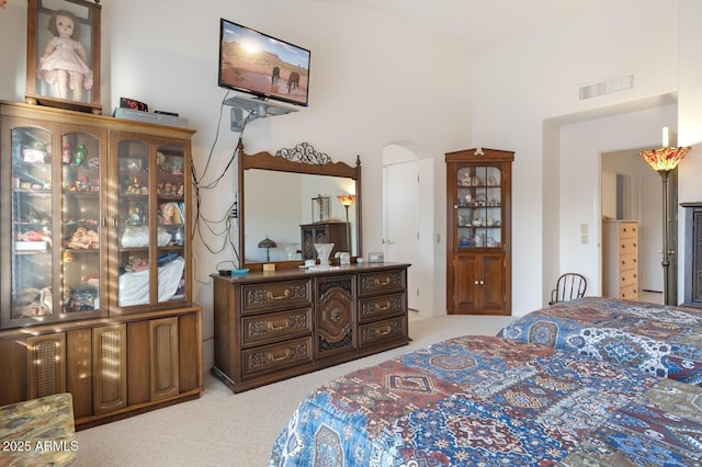 bedroom featuring light colored carpet