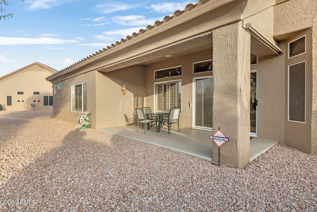 rear view of house featuring a patio