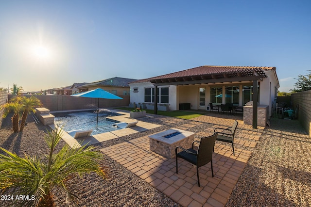 exterior space featuring an outdoor fire pit, a fenced in pool, a patio, and a pergola