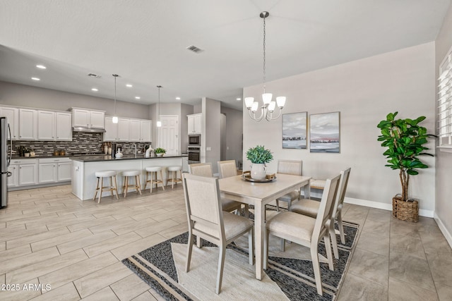 dining area featuring visible vents, baseboards, recessed lighting, and an inviting chandelier