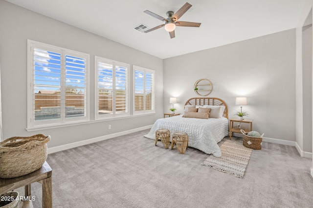 bedroom featuring visible vents, baseboards, a ceiling fan, and carpet floors