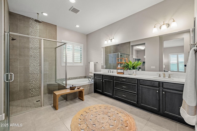 full bathroom with tile patterned floors, a sink, visible vents, and a stall shower