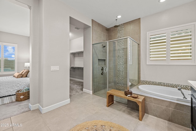 full bathroom with recessed lighting, tile patterned flooring, a bath, and a stall shower