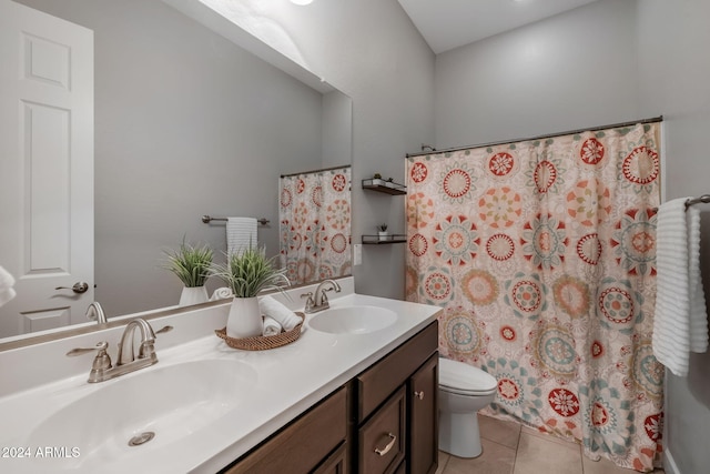 bathroom with walk in shower, vanity, tile patterned flooring, and toilet