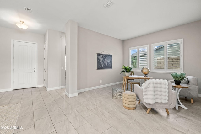 office featuring light tile patterned floors, baseboards, and visible vents