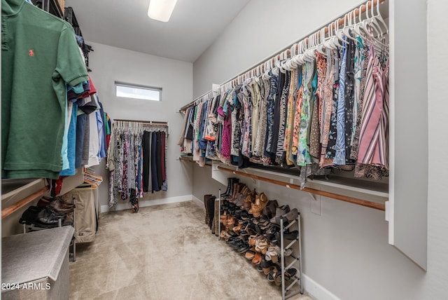 spacious closet with carpet flooring