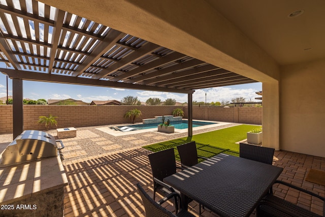 view of patio / terrace with outdoor dining space, a fenced backyard, an outdoor kitchen, and a fenced in pool