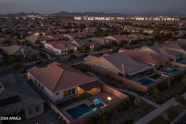 drone / aerial view featuring a residential view and a mountain view