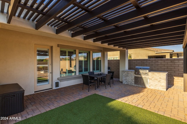 view of patio / terrace featuring grilling area, an outdoor kitchen, and a pergola