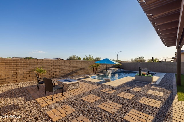 view of swimming pool featuring a patio and pool water feature