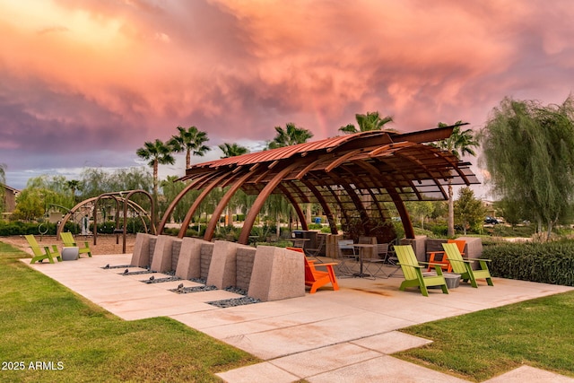 view of community with a gazebo, a patio, and a lawn