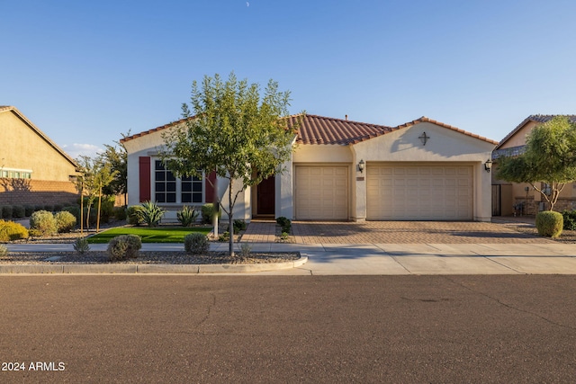 mediterranean / spanish-style home featuring a garage