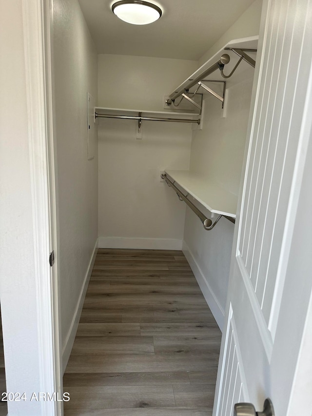 spacious closet featuring hardwood / wood-style flooring