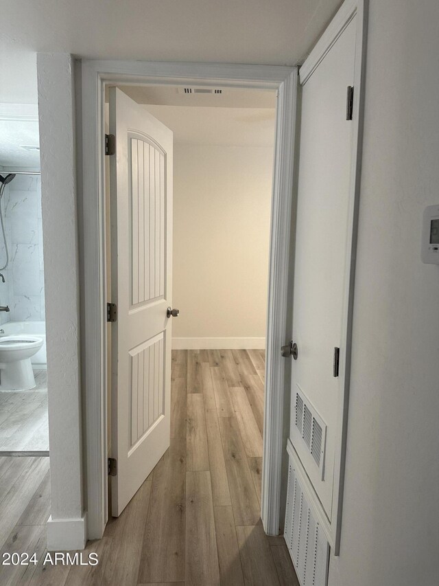 corridor featuring light hardwood / wood-style flooring