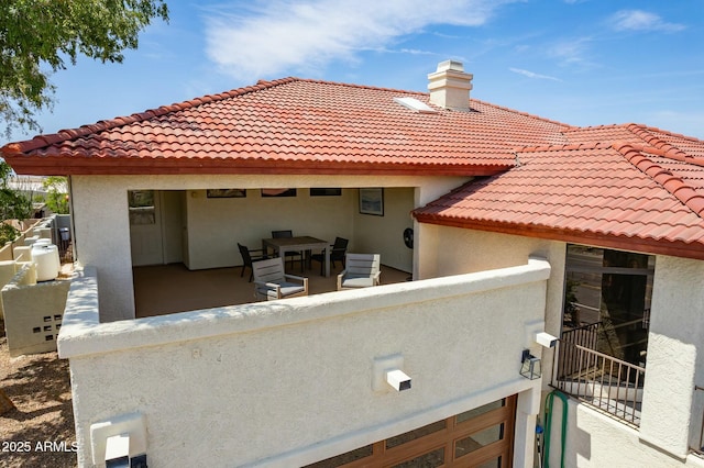 back of house with a balcony