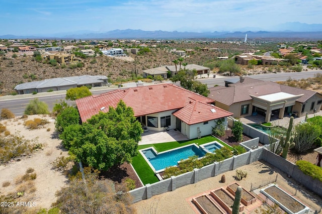 birds eye view of property featuring a mountain view