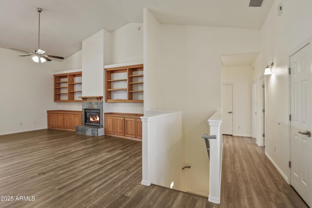 502 W Locust Rd, Payson, AZ 85541 - kitchen with high vaulted ceiling, a tiled fireplace, dark wood finished floors, a ceiling fan, and open shelves