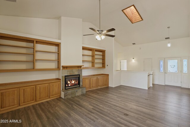 502 W Locust Rd, Payson, AZ 85541 - unfurnished living room with high vaulted ceiling, a ceiling fan, dark wood-type flooring, a fireplace, and baseboards