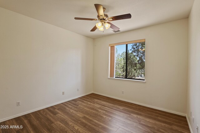 502 W Locust Rd, Payson, AZ 85541 - unfurnished room featuring dark wood finished floors, baseboards, and a ceiling fan