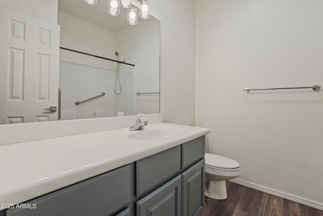 502 W Locust Rd, Payson, AZ 85541 - bathroom with toilet, baseboards, wood finished floors, vanity, and a shower