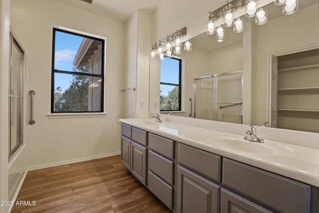 502 W Locust Rd, Payson, AZ 85541 - bathroom featuring healthy amount of natural light, wood finished floors, double vanity, and baseboards