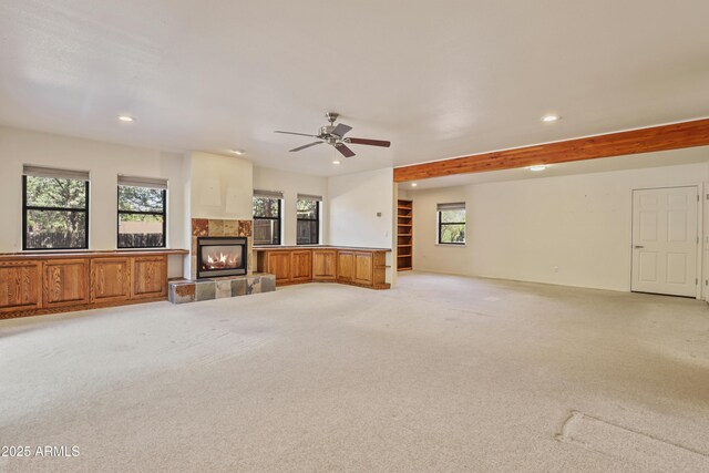502 W Locust Rd, Payson, AZ 85541 - unfurnished living room featuring recessed lighting, a tiled fireplace, light colored carpet, and a ceiling fan