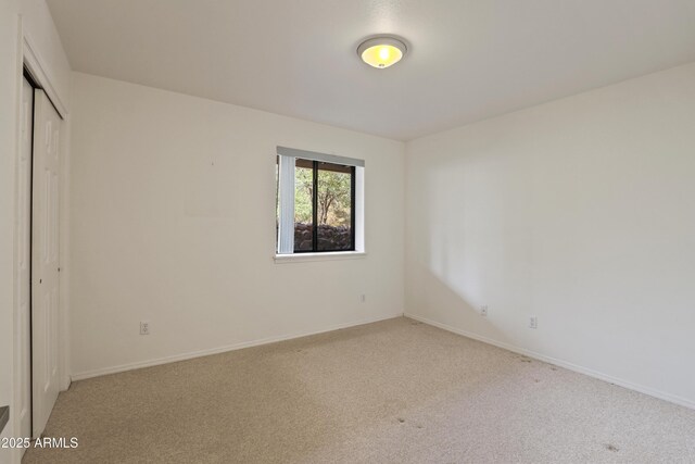 502 W Locust Rd, Payson, AZ 85541 - unfurnished bedroom with carpet flooring, a closet, and baseboards
